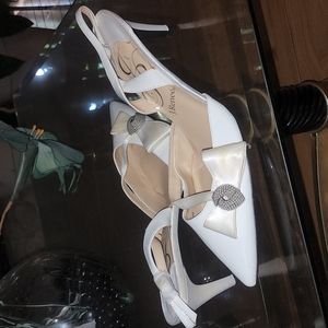 White, patent leather, slings with satin bow on side, topped w/rhinestone knot